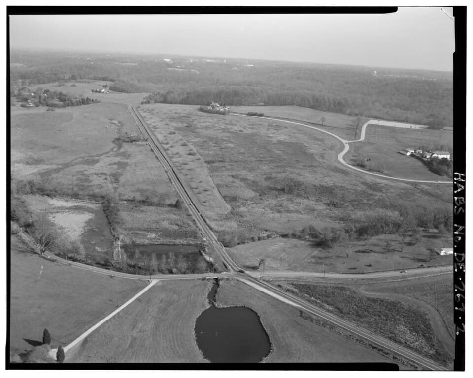 Aerial view northeast, State Route 92 bottom left and State Route 100 center, Brandywine Creek State Park center right, duck pond and reservoir center bottom. - Winterthur Farms, Intersection State Routes 92 and 100, Intersection State Routes 92 and 100, Winterthur, New Castle County, DE